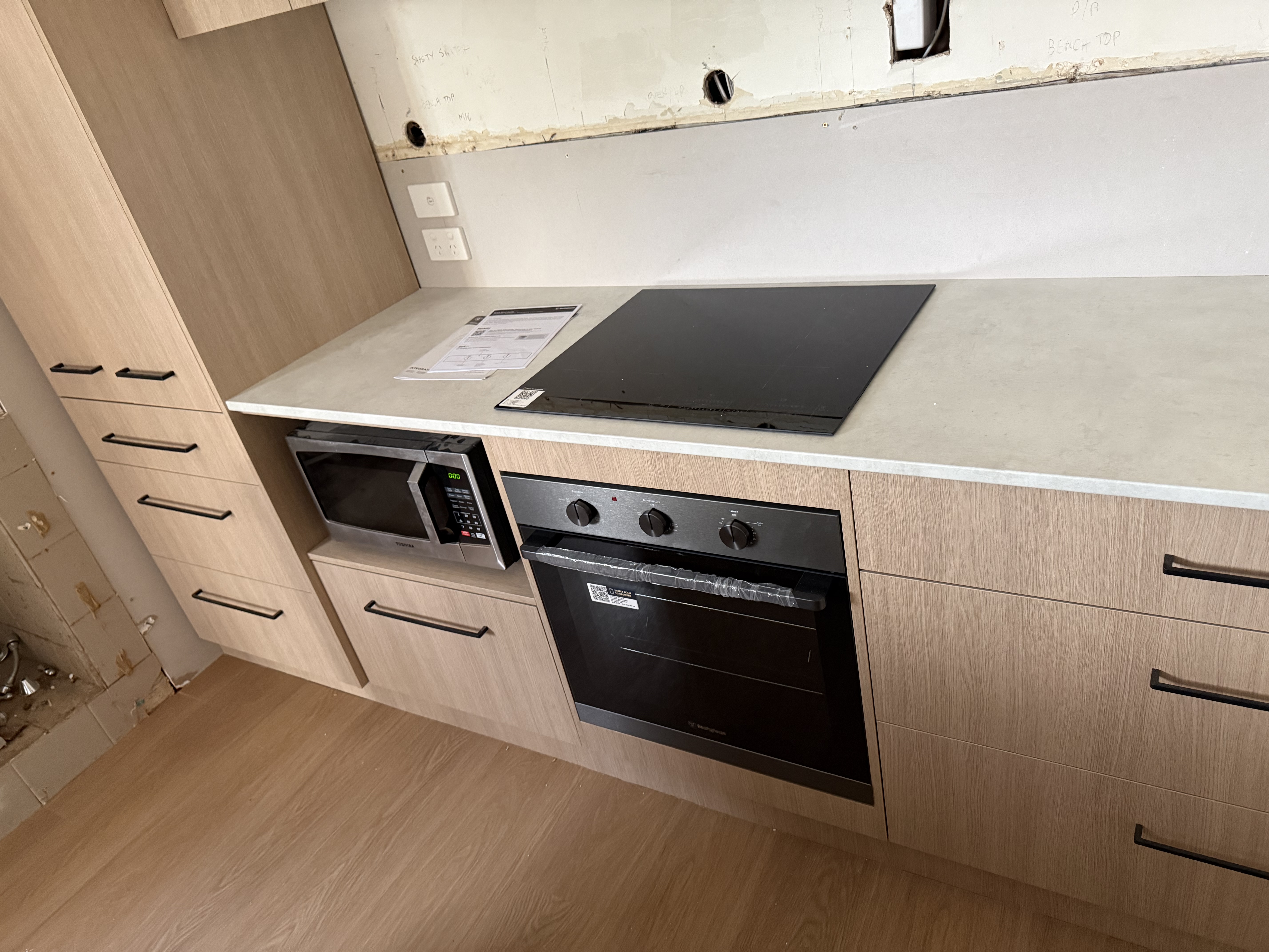 New oven, cooktop and cabinetry installed